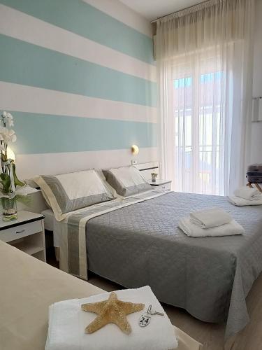 Postel nebo postele na pokoji v ubytování Hotel Cristoforo Colombo