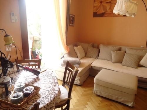 a living room with a couch and a table at Apartment Jafa in Tbilisi City