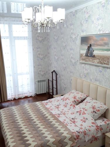 Llit o llits en una habitació de Райский приют у моря