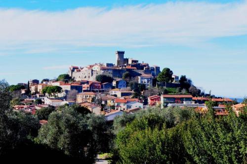 a town on top of a hill with houses at montecristo country house in Marsiliana