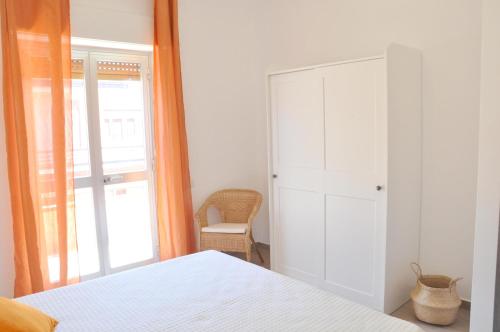 Postel nebo postele na pokoji v ubytování Casa Benny difronte al mare