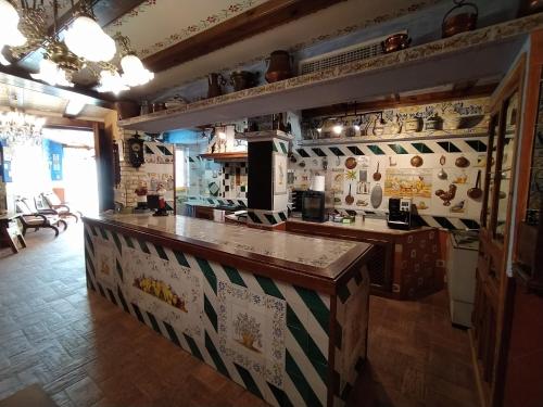 a kitchen with a counter in a room at A la Sombra de la Torre in Serra