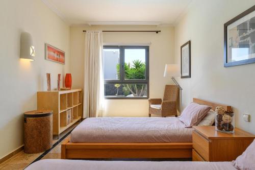 En eller flere senge i et værelse på Villa Marta