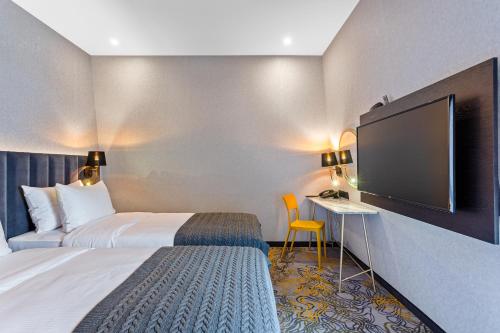 Кровать или кровати в номере Taberne Boutique Hotel Tbilisi