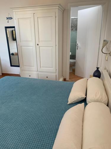 a bedroom with a bed with pillows on it at B&B Casavecchia in Gallipoli