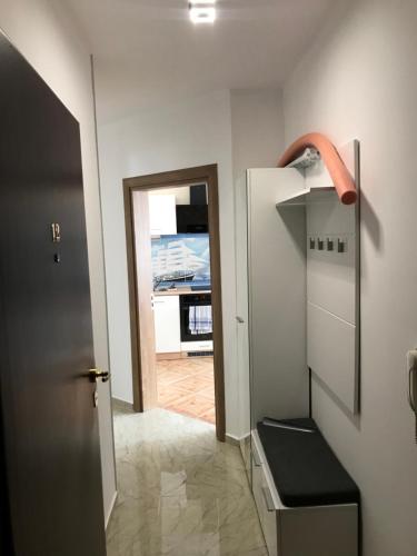 a room with a hallway with a door and a stair case at Familienapartment am Strand in Primorsko in Primorsko