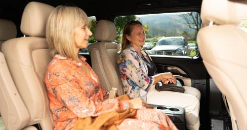 two women sitting in the back of a car at Hotel Seminario Aeropuerto Bilbao in Derio