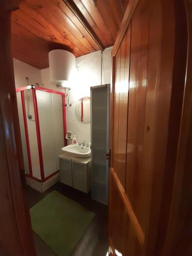 a small bathroom with a sink and a mirror at Casa Principe in Gressoney-Saint-Jean