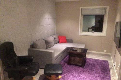 a living room with a couch and two chairs at Dallavaraveien 4 in Vadsø