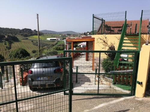 a car parked in the driveway of a house at Varandas da Serra II in Vila Franca de Xira