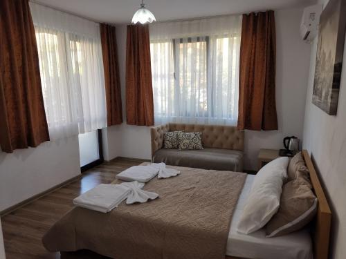 Postel nebo postele na pokoji v ubytování Hotel My House