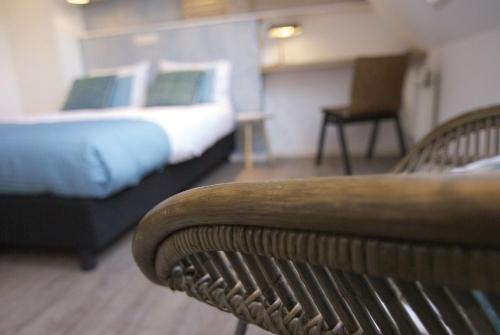 Een bed of bedden in een kamer bij Loods Hotel Vlieland