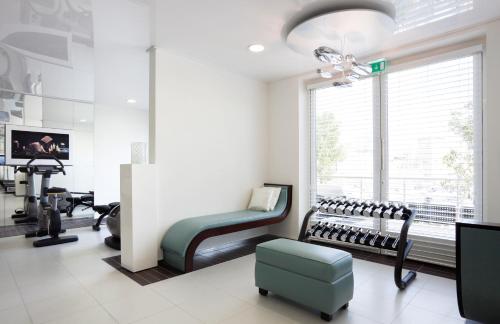 a hair salon with a chair and a mirror at Sofitel Marseille Vieux-Port in Marseille