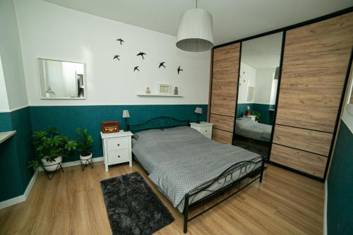 Posteľ alebo postele v izbe v ubytovaní Apartament Mały Rynek