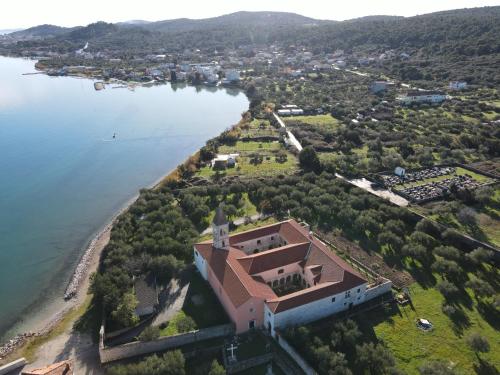an aerial view of a house on an island in the water at Apartment Lana in Pašman