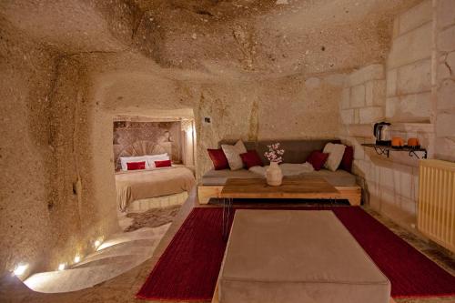 A bed or beds in a room at Sato Cave Hotel