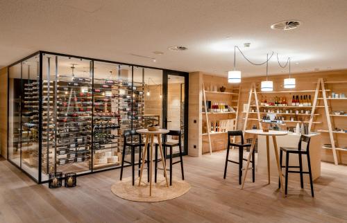 a tasting room with stools and a wine cellar at Fuchsegg Eco Lodge in Egg
