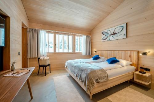 En eller flere senger på et rom på Fuchsegg Eco Lodge