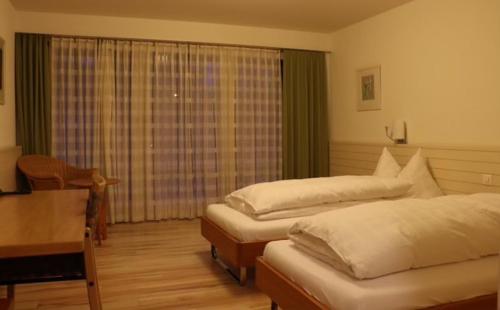 Ліжко або ліжка в номері Hotel Breiti
