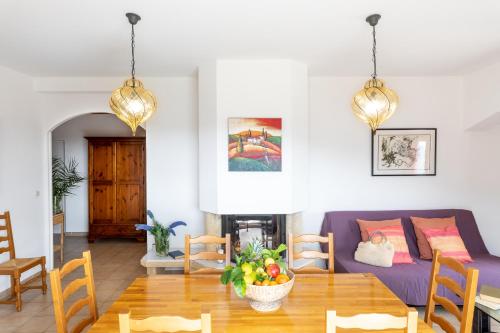a living room with a couch and a table at Residence Helios in Cargèse