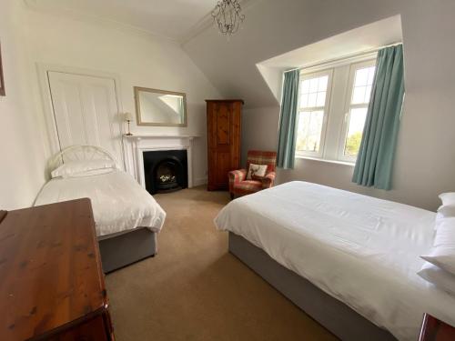 Ένα ή περισσότερα κρεβάτια σε δωμάτιο στο Stanford House