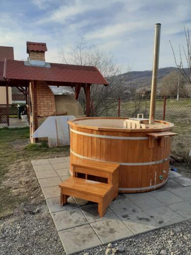 a wooden bath tub sitting on top of a table at Casa Loksi in Sovata
