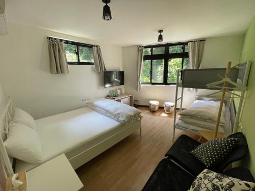 Postel nebo postele na pokoji v ubytování Lucky House B&B