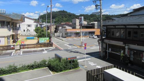 an empty street in a town with a building at Spa Hotel Alpina Hida Takayama in Takayama