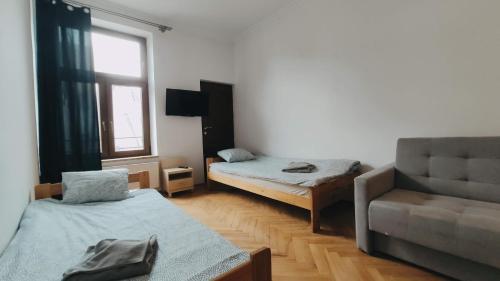 מיטה או מיטות בחדר ב-Floriańska 10 by Homeprime