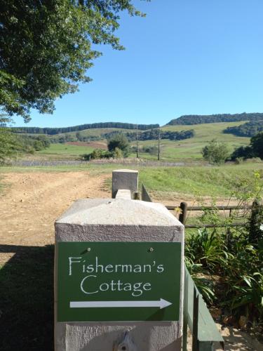 a sign for a fishgramgrams cottage on a field at Old Balgowan Farm Cottage in Balgowan