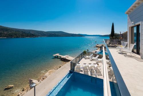 a house with a view of a body of water at Ville Sol Del Mar in Slano