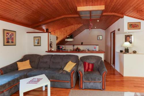 a living room with a couch and a table at Old Town Princess Apartments in Dubrovnik