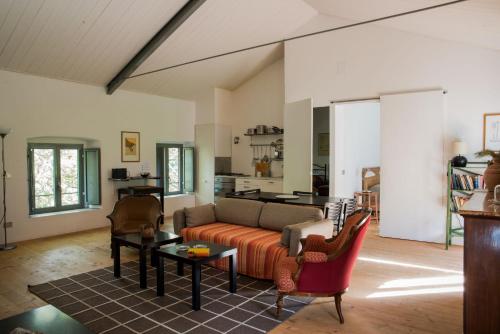 a living room with a couch and a table at Torre Camigliati Dimora Storica in Camigliatello Silano
