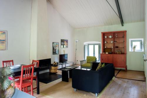 a living room with a couch and a table at Torre Camigliati Dimora Storica in Camigliatello Silano
