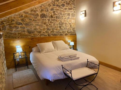 En eller flere senge i et værelse på Alojamiento Rural El Molino de Butrera