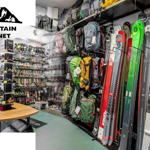 a room with a bunch of skis and snowboards at Hotel Le Alpi in Livigno