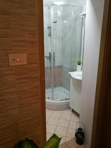 a bathroom with a shower and a toilet and a sink at Uphill Opatija Apartment in Opatija