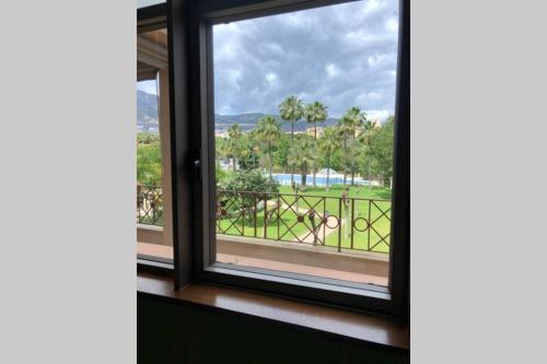 a window in a room with a view of a park at Apartment in Benalmádena - Luxury Complex Bellagio in Benalmádena