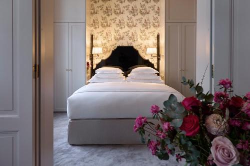 a bed in a room with a white bedspread at Villa Dagmar in Stockholm