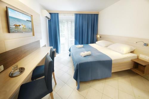 
Postelja oz. postelje v sobi nastanitve Villa Bor - Hotel & Resort Adria Ankaran
