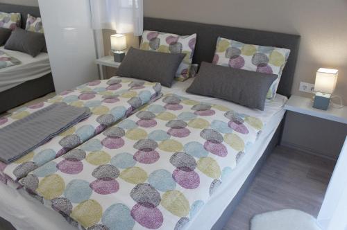 a bedroom with a large bed with polka dots at Bori Villa Siófok in Siófok
