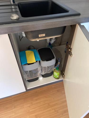 a kitchen counter with a sink and some food at Deluxe Apartments Messe Flughafen in Leinfelden-Echterdingen