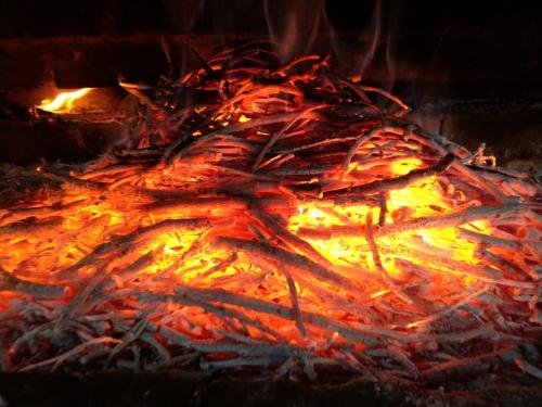 a fire is burning in a fire oven at Popock City Center in Yerevan