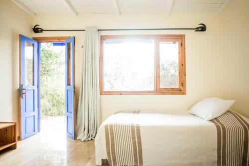 a bedroom with a bed and a window at Dakhla Attitude in Dakhla