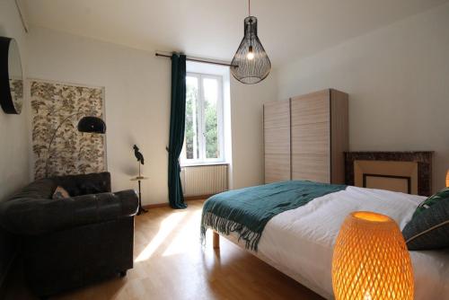 Postel nebo postele na pokoji v ubytování Appartements Le Cru Colbert