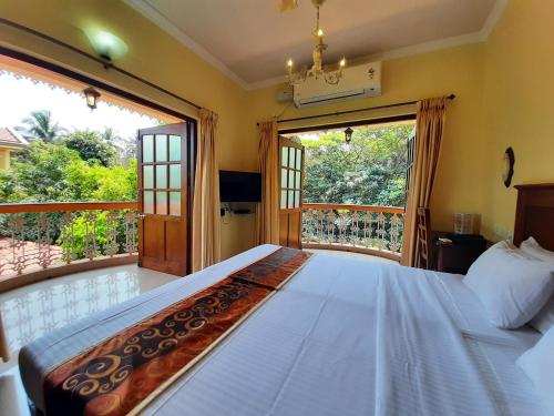 Tempat tidur dalam kamar di Resort Palmeiras Dourado