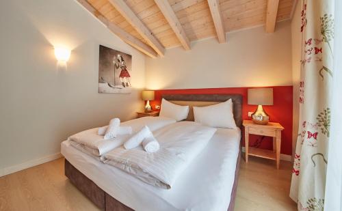Posteľ alebo postele v izbe v ubytovaní Hüttl Relax Appartements