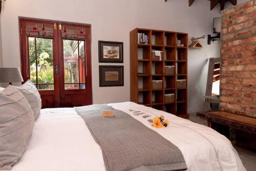 מיטה או מיטות בחדר ב-VillaChad Guesthouse