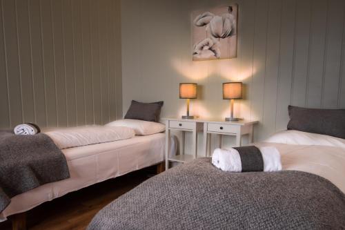 Säng eller sängar i ett rum på Storestølen Fjellhotell