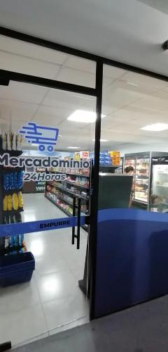a view of a store with a counter in a store at Apartamento 50m2 Hospital Einstein Morumbi in Sao Paulo